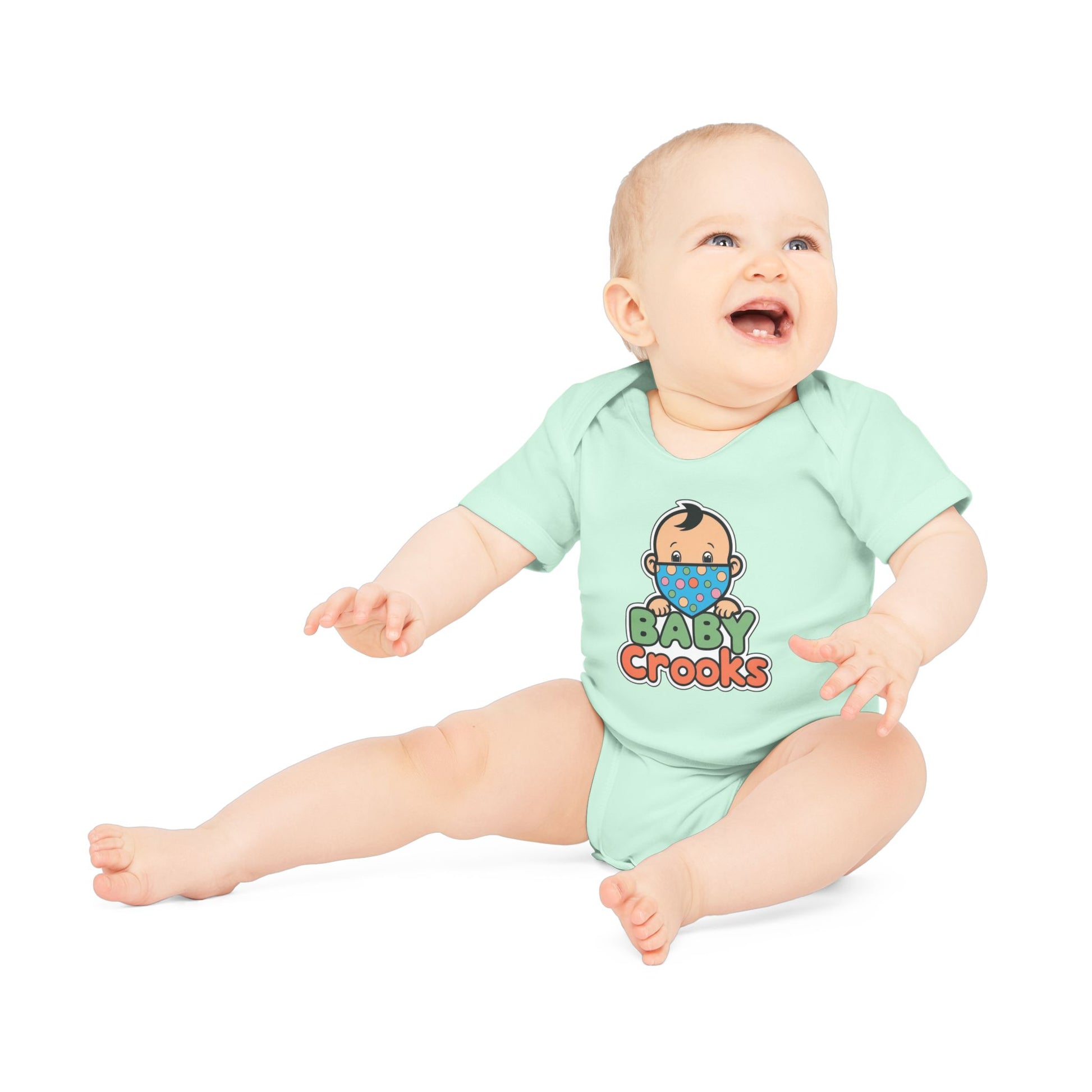 Baby wearing a light green onesie with 'Baby Crooks' text and graphic on a white background